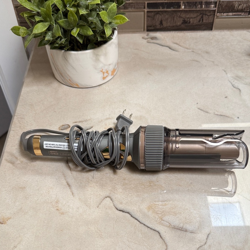 Sleek Gray Curling Iron